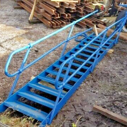 USED STEEL STAIRCASE C/W HANDRAILS .